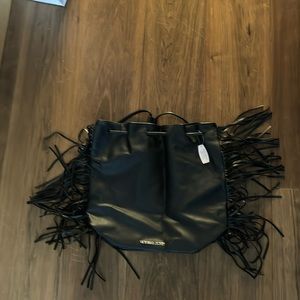 New, never used Victoria Secret backpack bag. Faux leather with fringe